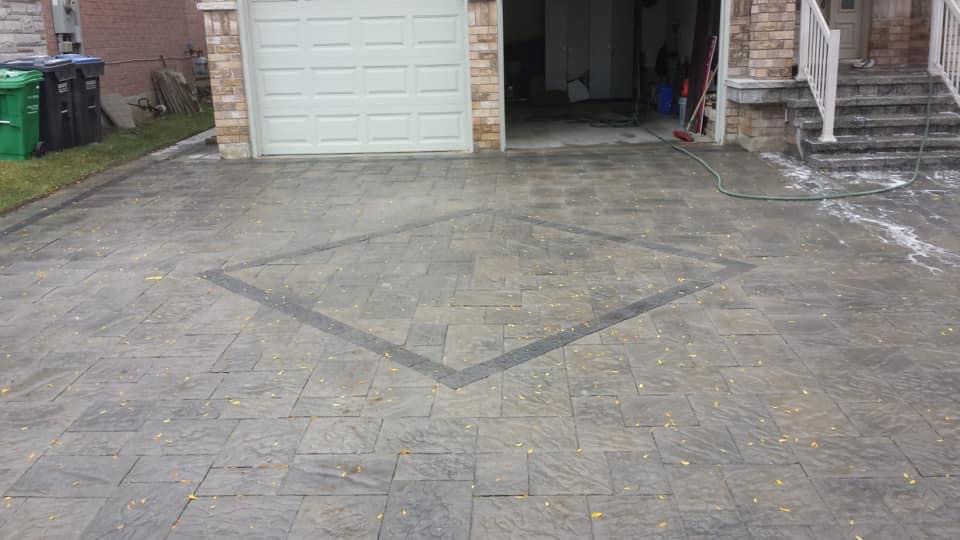 Stamped concrete driveway with inset diamond pattern